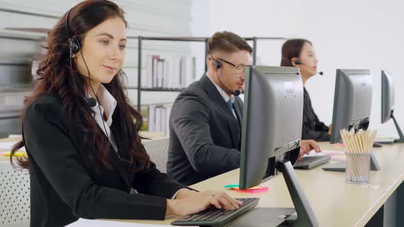 Business People Wearing Headset Working in Office