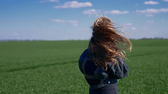 Free girl running fun across the green field