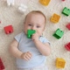 Portrait of Little Baby Boy Chewing and Biting Colorful Toys While Hes Teeth is Growing - VideoHive Item for Sale