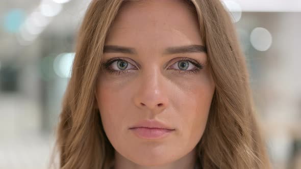 Close Up of Face of Serious Woman Looking at the Camera