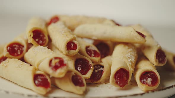 Stack of Fresh and Delicious Cookies Stuffed with Red Jam and Sprinkled with Sugar