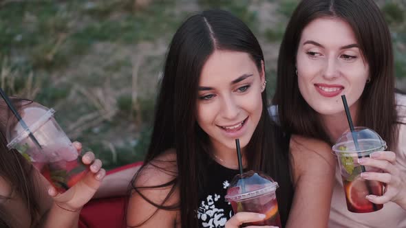 European Girls Are Drinking Cocktails and Smiling