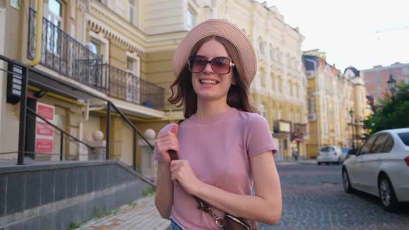 Beautiful Young Woman Tourist Pleasant Walk in the City Center