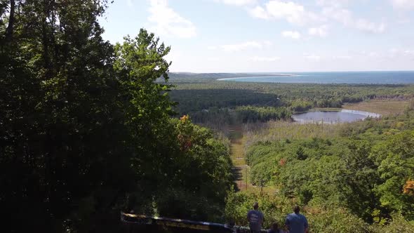 People Admiring Forested Landscape Of Sleeping Bear Dunes National Lakeshore And Glen Lake Along The