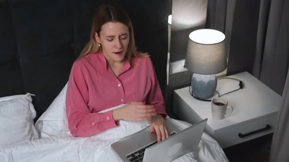 Tired Caucasian Woman Working Laptop on Bed at Home Tired Pretty Woman Yawning and Work Laptop