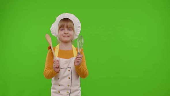 Girl Kid Dressed As Cook Chef Baker Posing Smiling Looking at Camera on Chroma Key Background