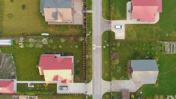 Cottage Houses with Colorful Roofs Surrounded By Green Lawns