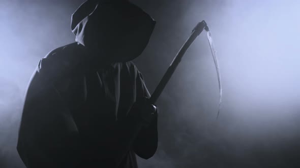 Horrible Dark Figure In A Hoodie With A Scythe