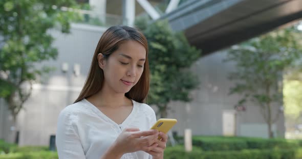 Woman Use of Smart Phone at Outdoor