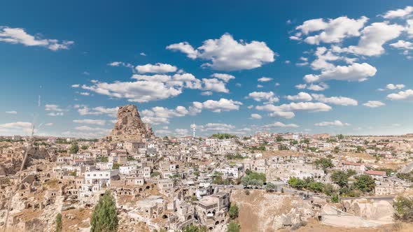 View of Ortahisar Town Old Houses in Rock Formations From Ortahisar Castle Aerial Timelapse