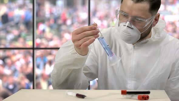 Scientist Shaking Test Tube with Reagents To Observe a Reaction