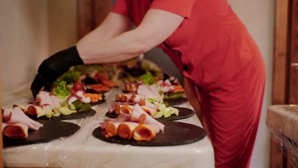 Female Chef Serving Meat and Vegetable Snacks in Restaurant Kitchen