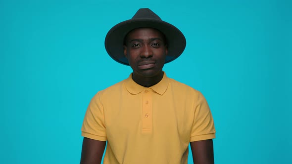 Handsome Man Expressing Disregard Over Blue Background