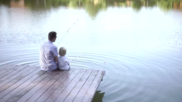 Dad and son fishing 