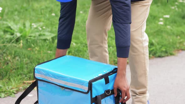 Food Delivery Man Closing Thermal Insulated Bag