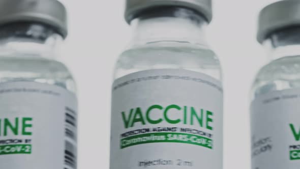 Flacons of Vaccine for COVID19 Coronavirus Cure Are Rotated Quickly and Then Slowly in Research Lab