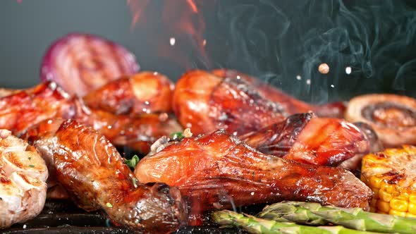 Super Slow Motion Shot of Seasoning Falling on Fresh Grilled Chicken Legs at 1000 Fps