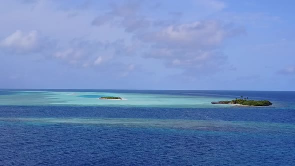 Drone aerial landscape of marine coast beach by blue lagoon and sand background