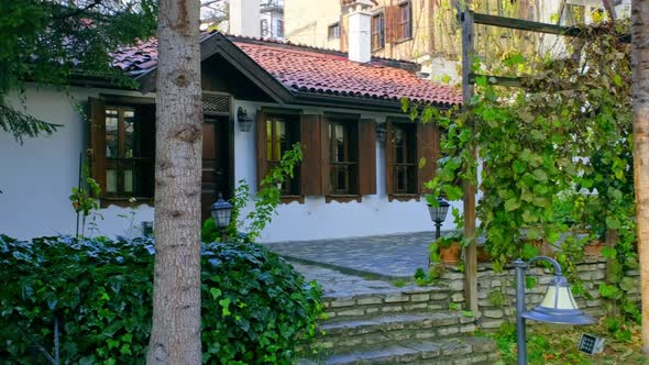 House with Wooden Windows in the Garden