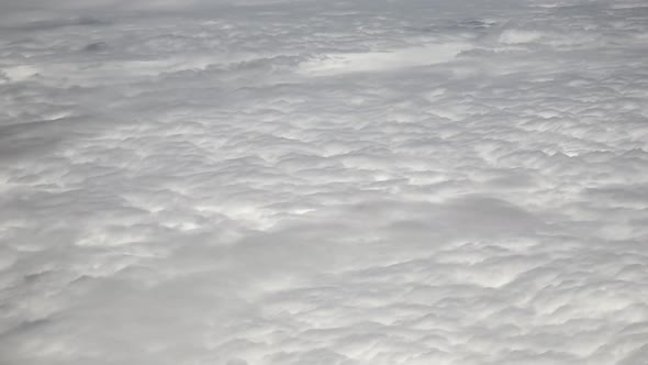 Sunny Landscape Above Clouds From Airplane Window 