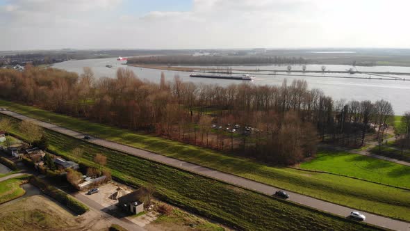 Aerial Over Dyke Embankment Beside Oude Maas In Barendrecht. Circle Dolly