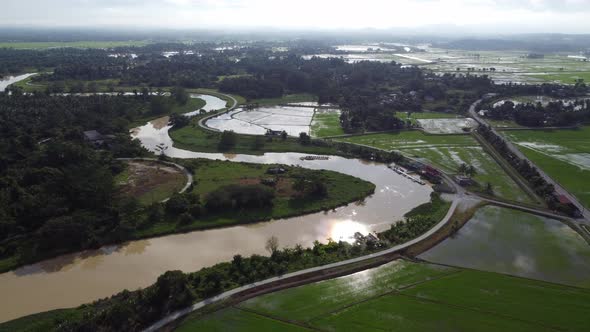 Aerial view curve river near water paddy