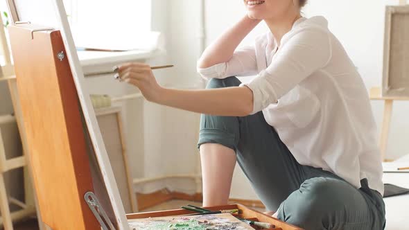 Young Pleasant Woman Developing Her Artistic Skills