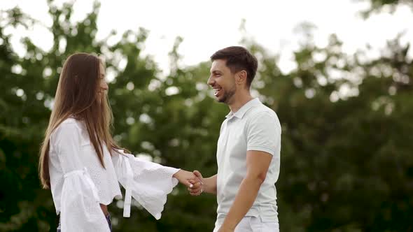 Romantic Happy Couple Having Fun And Dancing Outdoors In Nature.