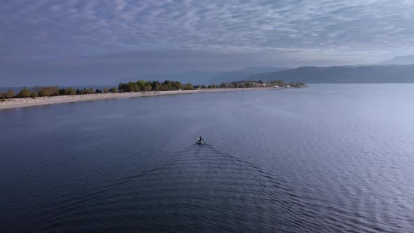 Ship is Swimming on the Egirdir Lake to Peninsula Filmed By Drone at Summer Day