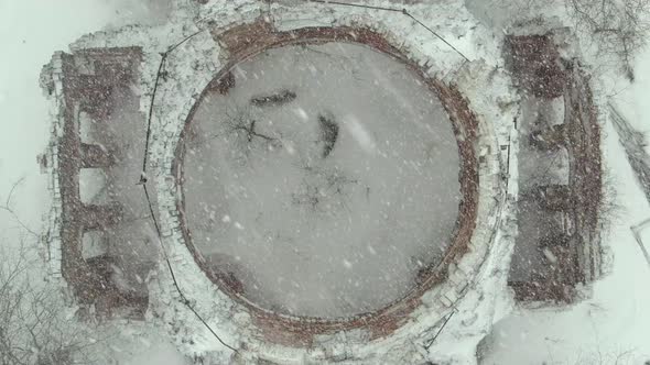 top view on the ruined church during a snowfall