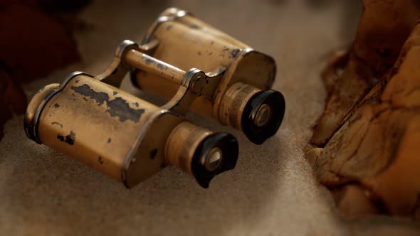 Old German Military Binoculars on the Sand Beach alt