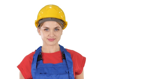 Smiling constructor worker woman standing and changing