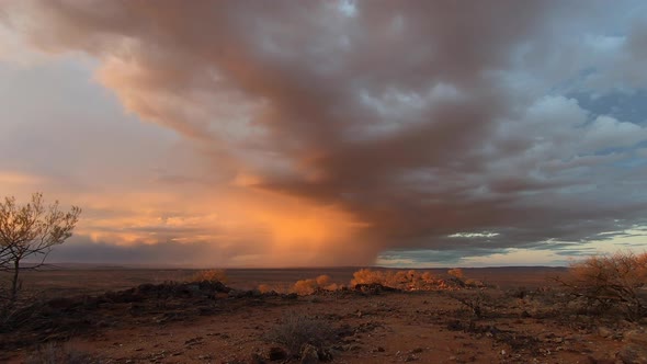 Storm clouds over the harsh Australian outback at sunset