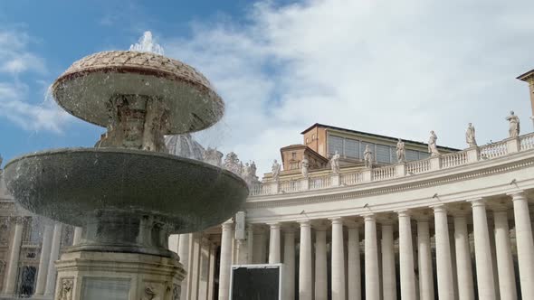 Fountain against Saint Peter's Basilica at Vatican square.