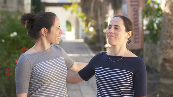 Two Caucasian female identical twins spending quality time together