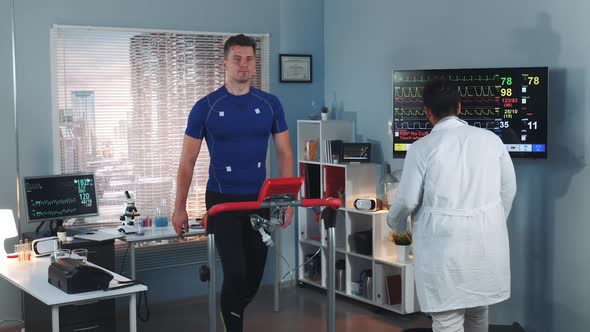 Scientific Sports Laboratory Doctor Coming to Monitor Athlete's Stress Testing