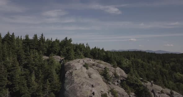 Aerial Drone Shot Flying Over Mountain Summit Tree Line