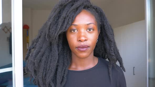 Slow motion shot of young woman with dreadlocks