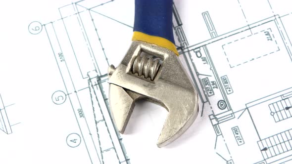 Adjustable Wrench on Building Plan, Scheme, Rotation, Close Up