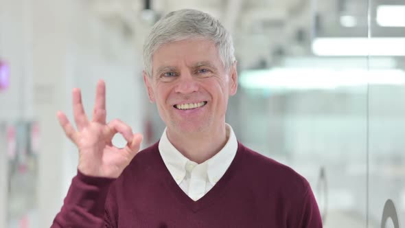 Middle Aged Man Showing Ok Sign By Hand