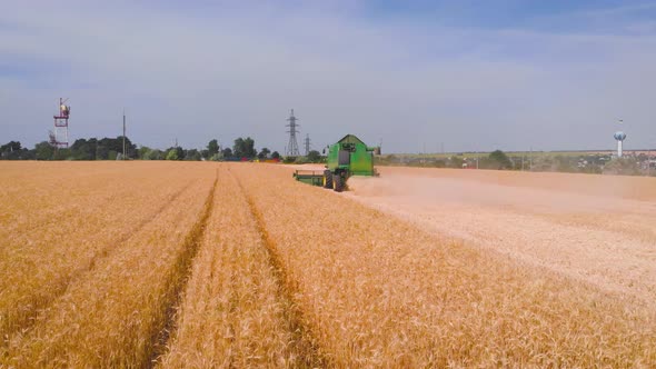  Impressive Flight Over a Working Combine Harvesting Tons of Ripe Barley