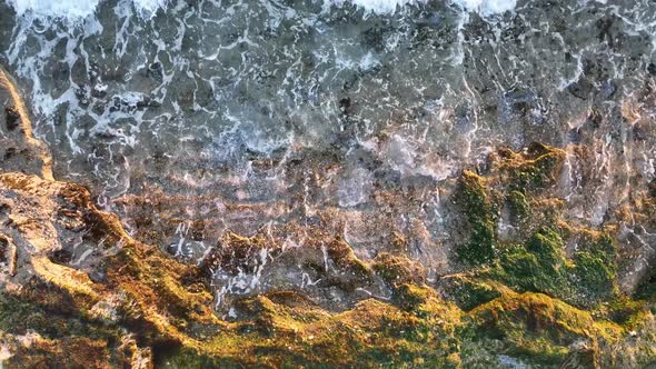 Texture of the rocky beach aerial view 4 K Turkey Alanya