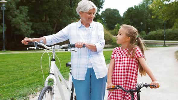 Grandmother and Granddaughter with Bicycles 