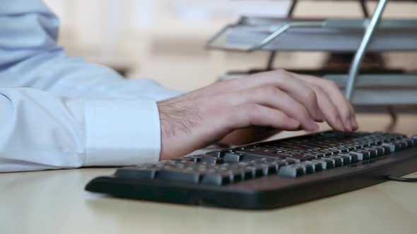 Office worker using computer keyboard