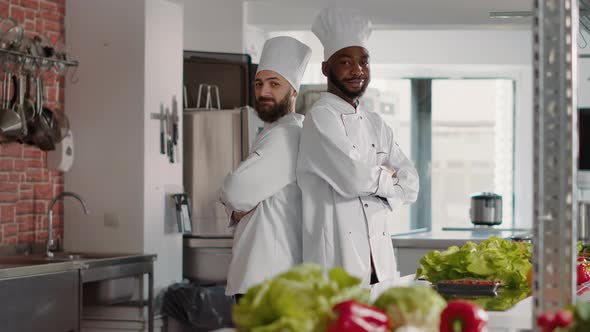 Portrait of Diverse Team Posing in Professional Restaurant Kitchen