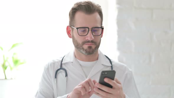 Portrait of Doctor Using Smartphone