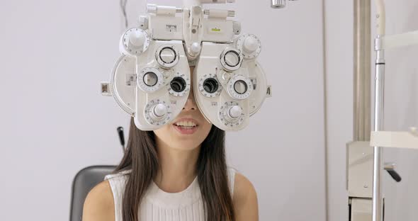 young woman having eye test