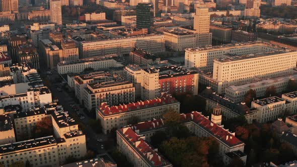 Slide and Pan Shot of Large Apartment or Administrative Buildings in Town Illuminated By Bright