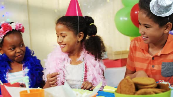 Kids having cake during birthday party 4k