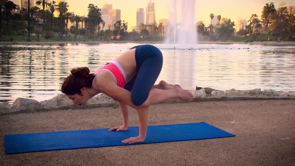 Woman Doing Yoga In The Park At Dawn